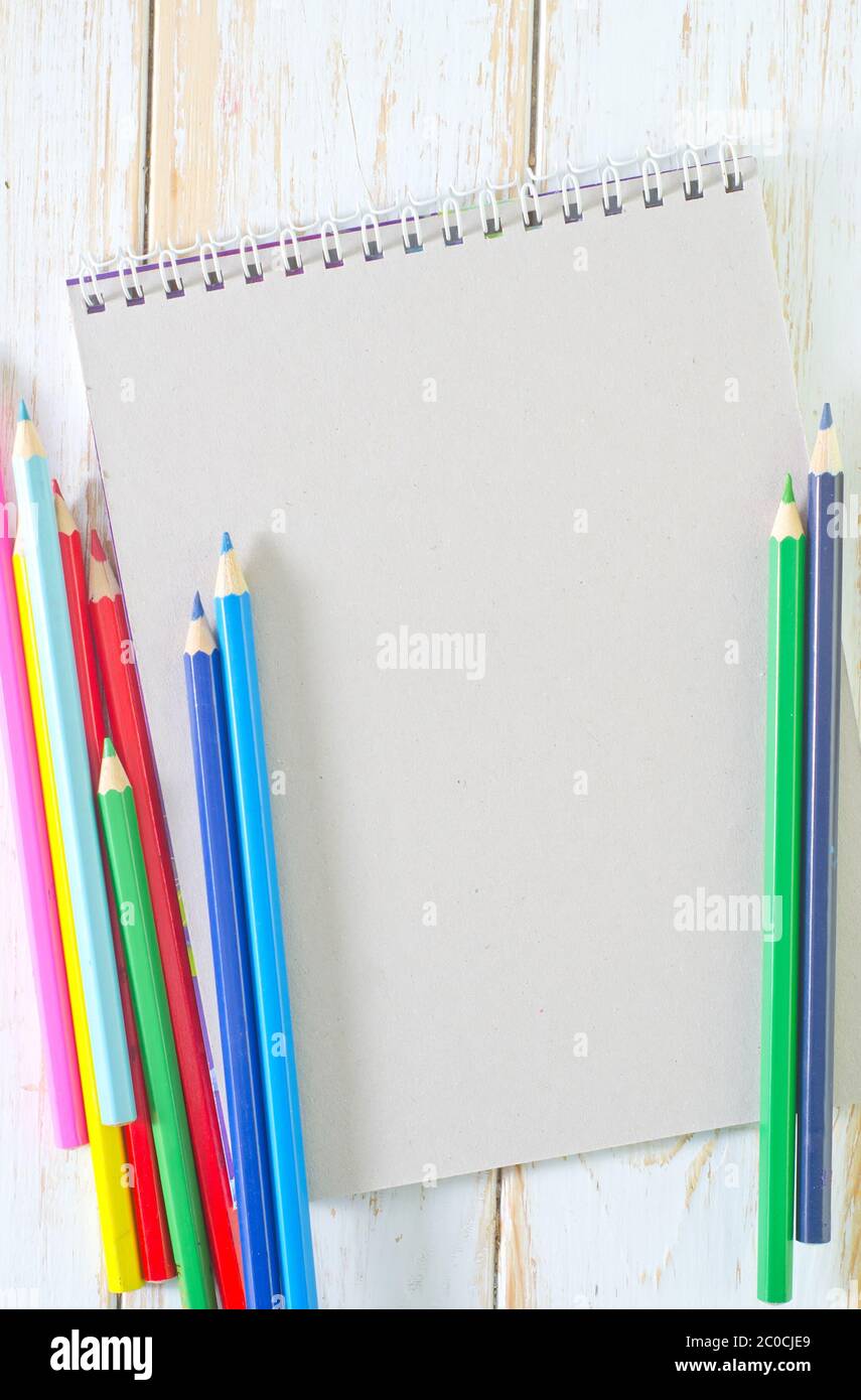 note and pencils Stock Photo - Alamy