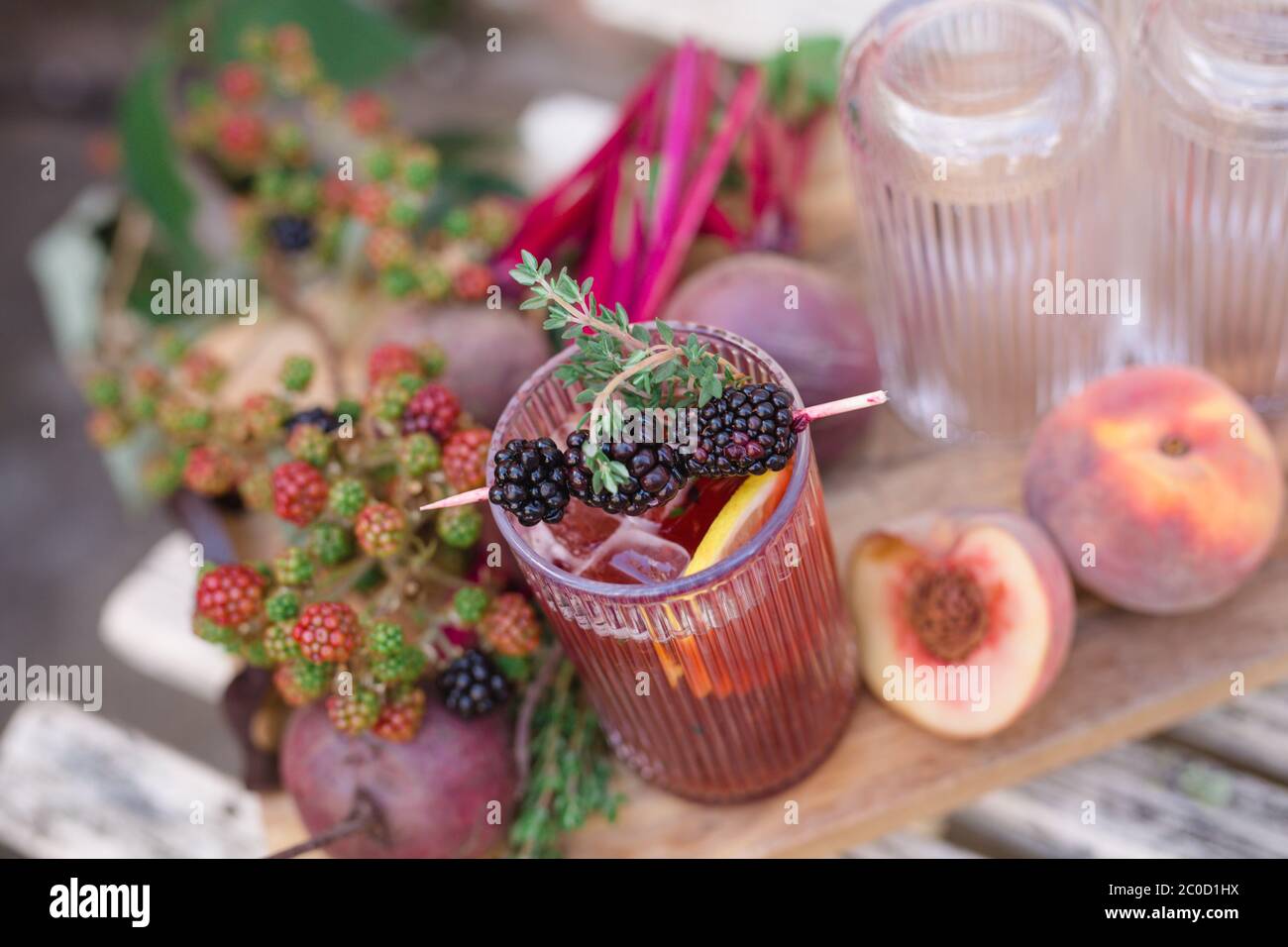 Wild berry cocktail in highball glass for picnic or party or rustic drink recipe Birdseye view Stock Photo