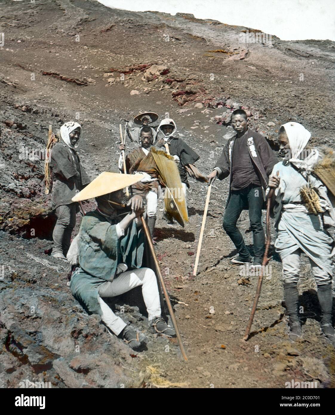 [ 1900s Japan - Mount Fuji Pilgrims ] — Pilgrims and their guide descent after climbing Mount Fuji.  20th century vintage glass slide. Stock Photo