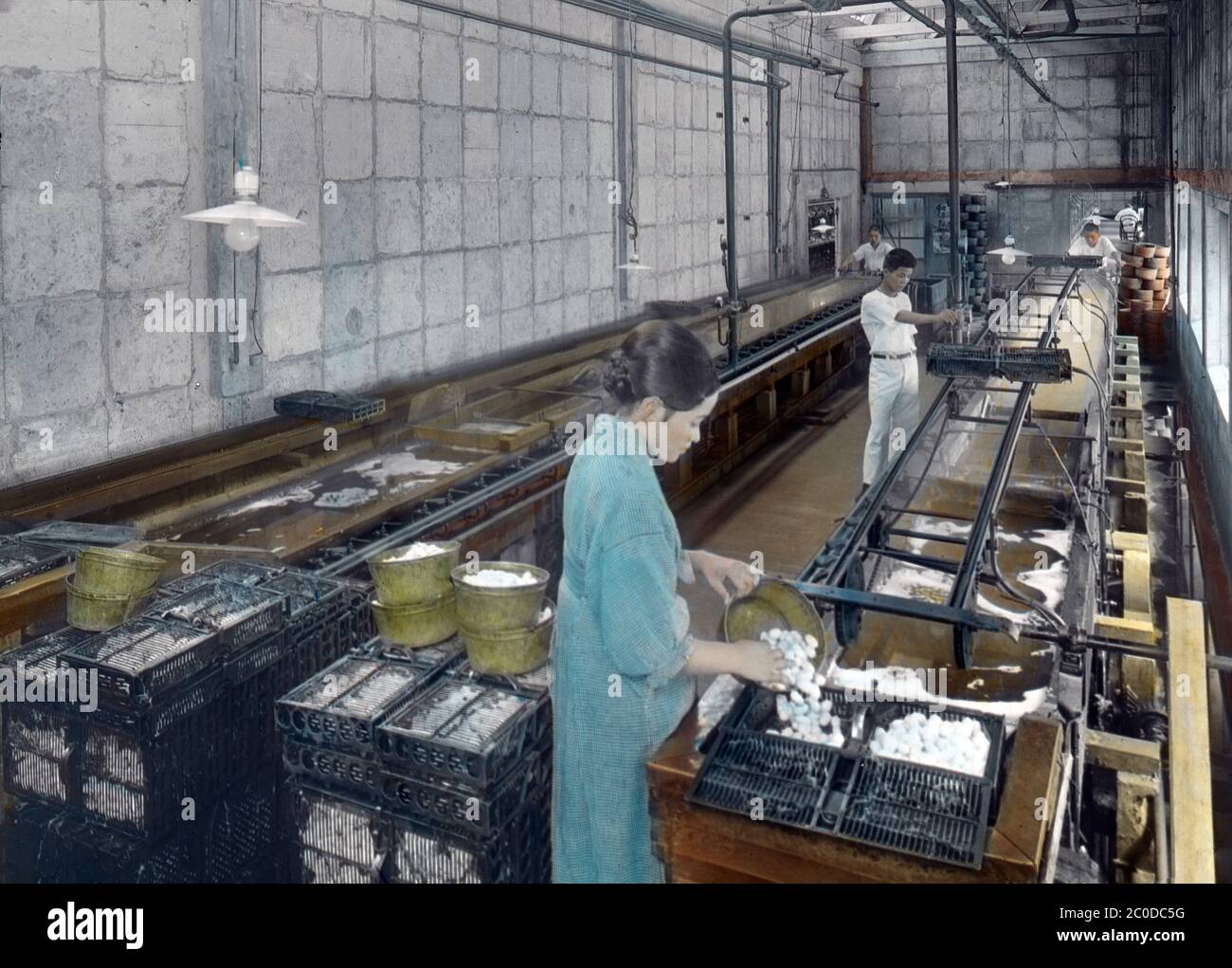[ 1900s Japan - Japanese Silk Factory ] — Boiling cocoons for reeling silk at a silk factory.  Original title: 656 Boiling the cocoons for spinning  20th century vintage glass slide. Stock Photo