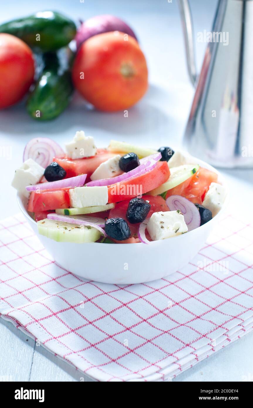 Greek salad with feta cheese tomatoes cucumbers and black olives Stock Photo