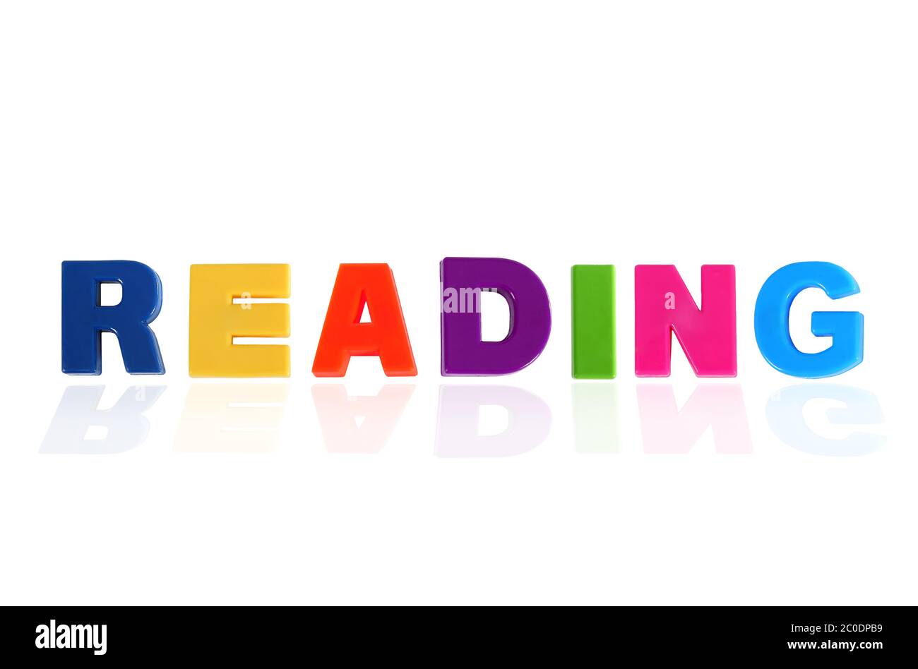 Reading written In Multicolored Plastic Kids Letters Stock Photo