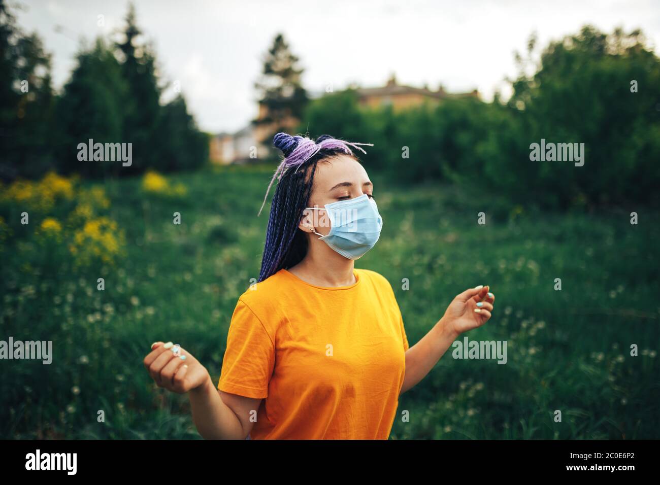 Download Young Beautiful Girl In A Medical Mask In A Yellow Open Air T Shirt Stock Photo Alamy Yellowimages Mockups