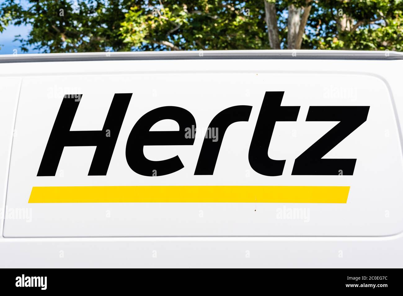June 10, 2020 Sunnyvale / CA / USA - Hertz logo displayed on a van available for rent; The Hertz Corporation filed for bankruptcy on May 22 as result Stock Photo