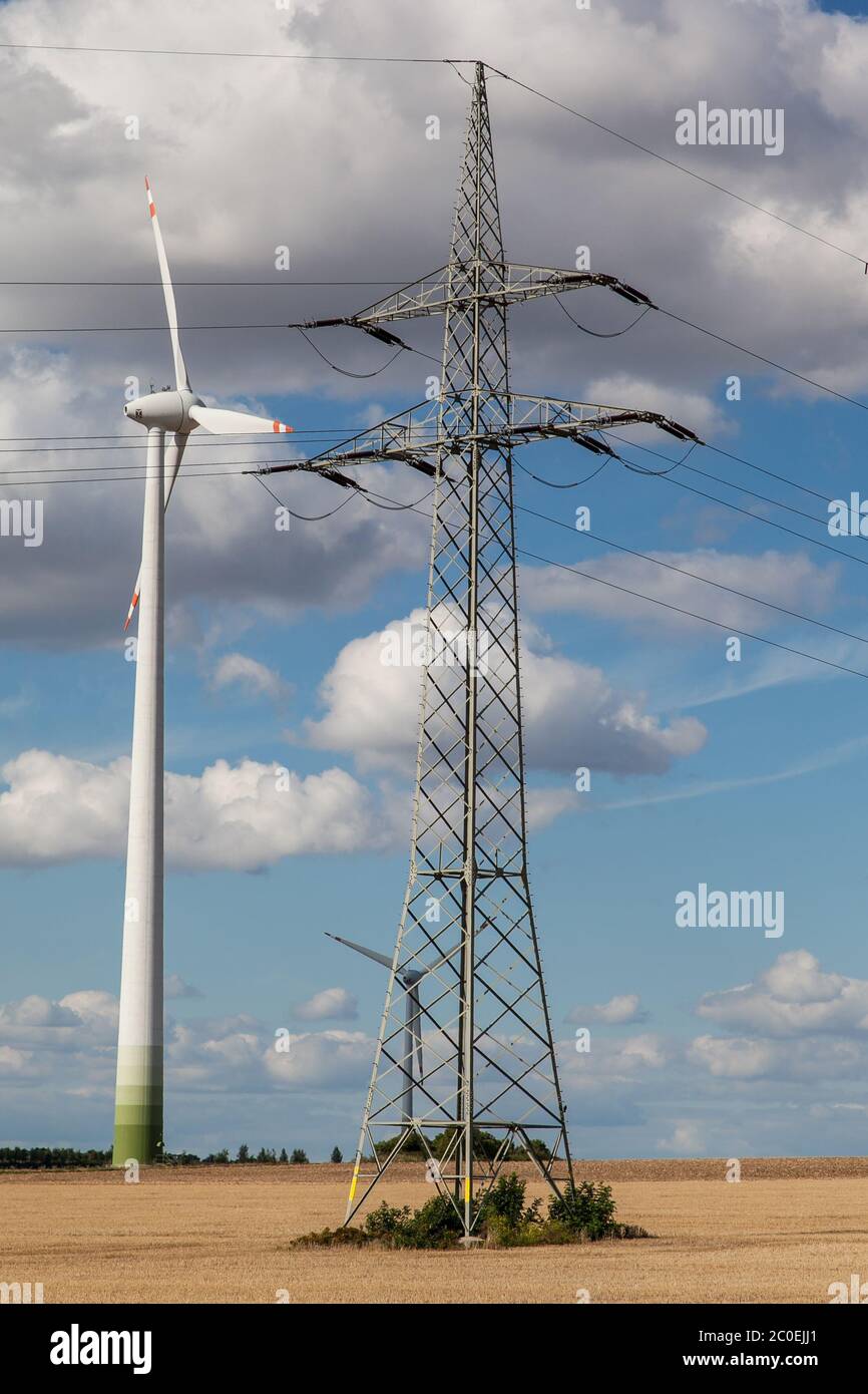 Wind turbines with overhead power line Stock Photo