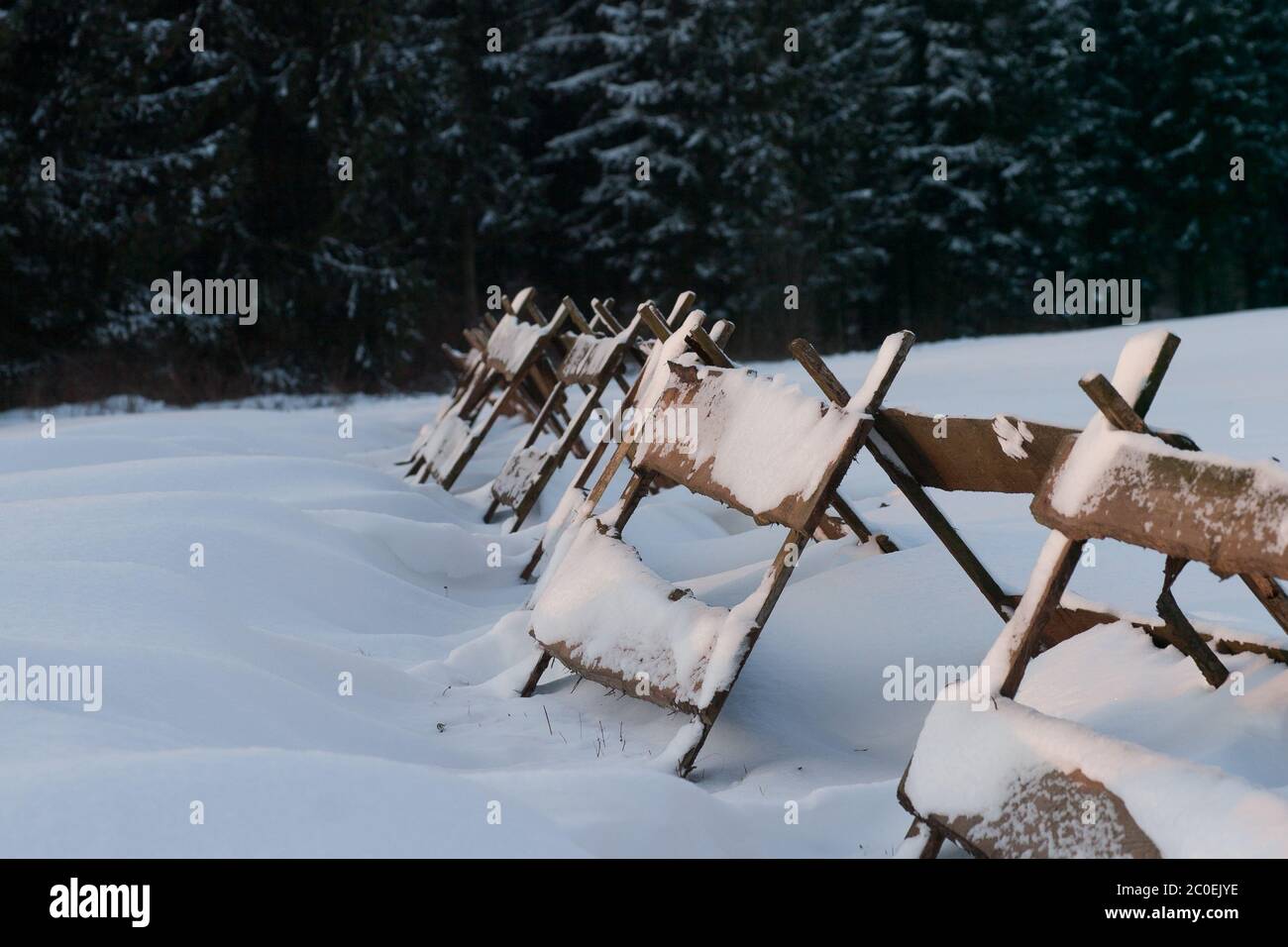 Snow fence made of wood Stock Photo
