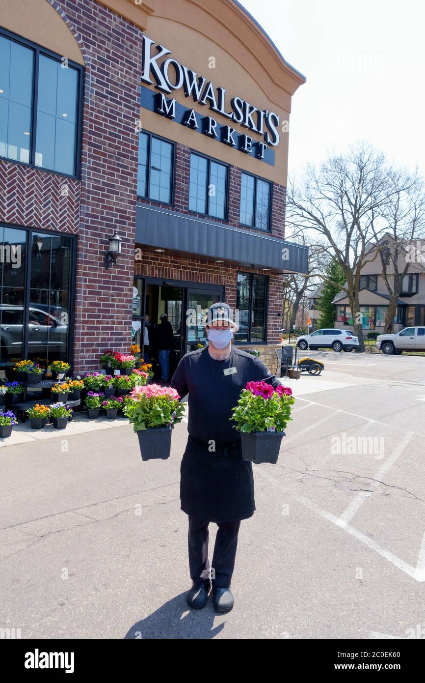 Kowalski's Market charming door greeter delivers two pots of