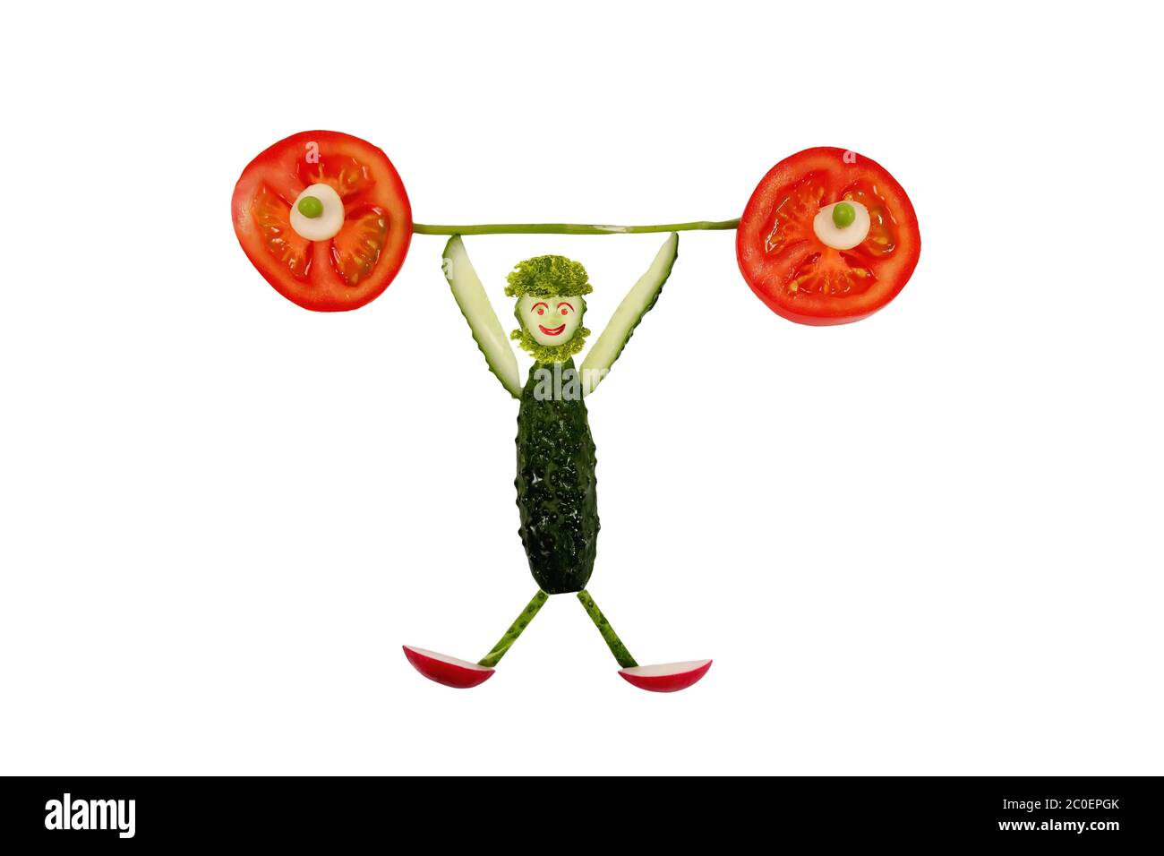 Healthy eating. Funny little man of the cucumber slices raises tomato bar. Stock Photo