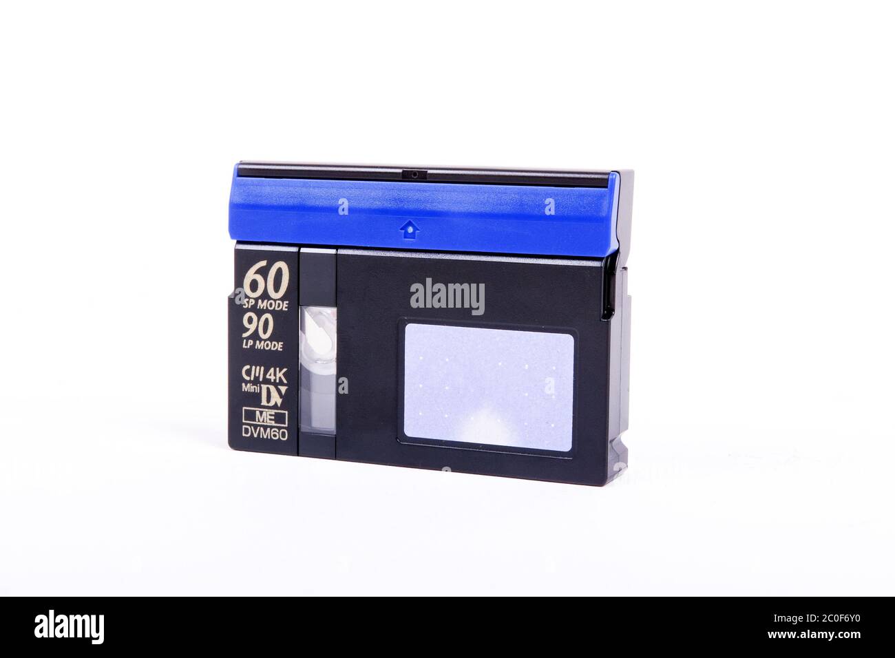 Cassette into the camera on a white background Stock Photo Alamy