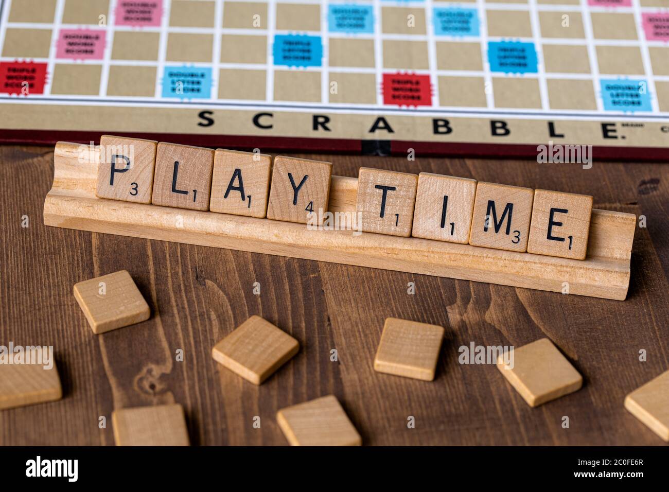 Scrabble board game with the scrabble tile spelling "Play Time" on