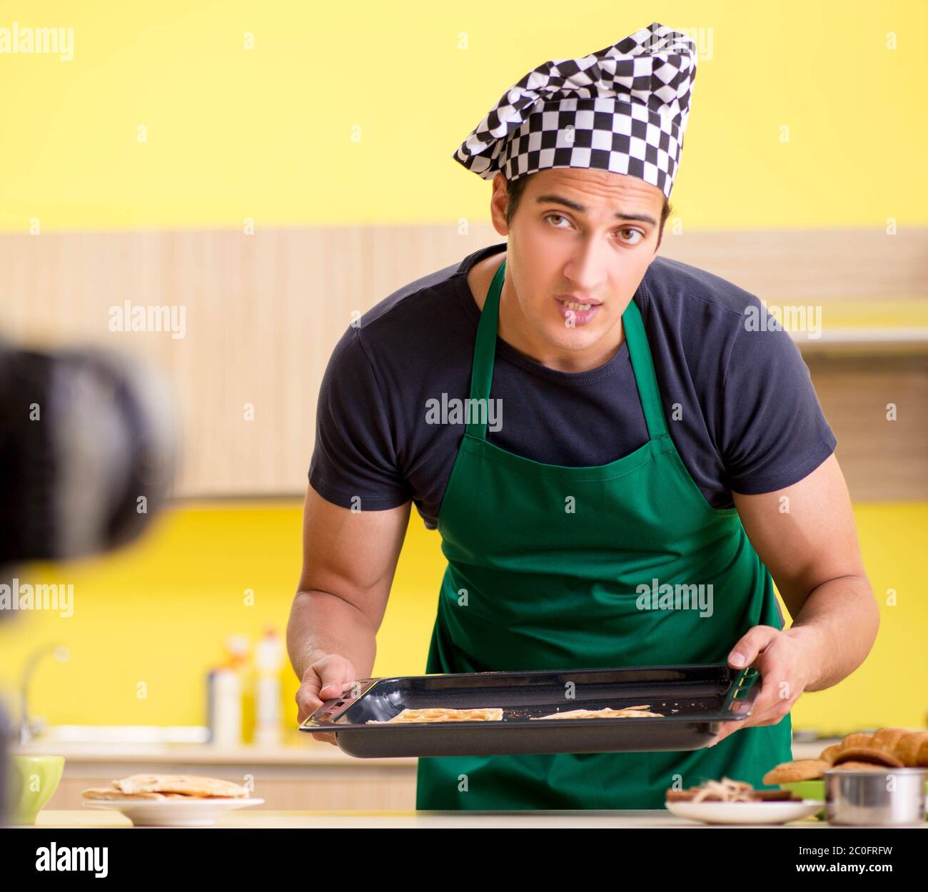 The young chef blogger explaining food preparation Stock Photo