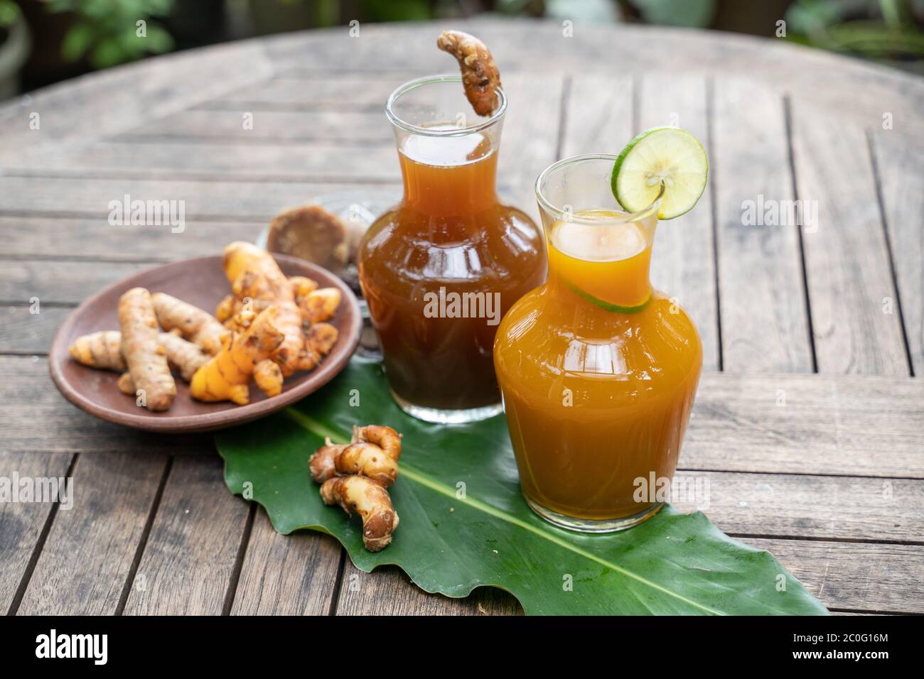 health drink in a glass bottle, herbal turmeric tamarind health drink