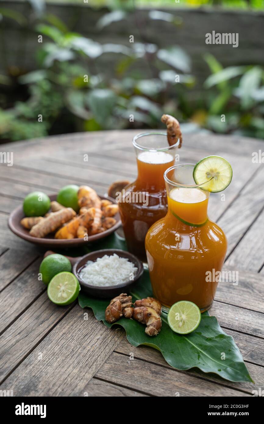 health drink in a glass bottle, herbal turmeric tamarind health drink