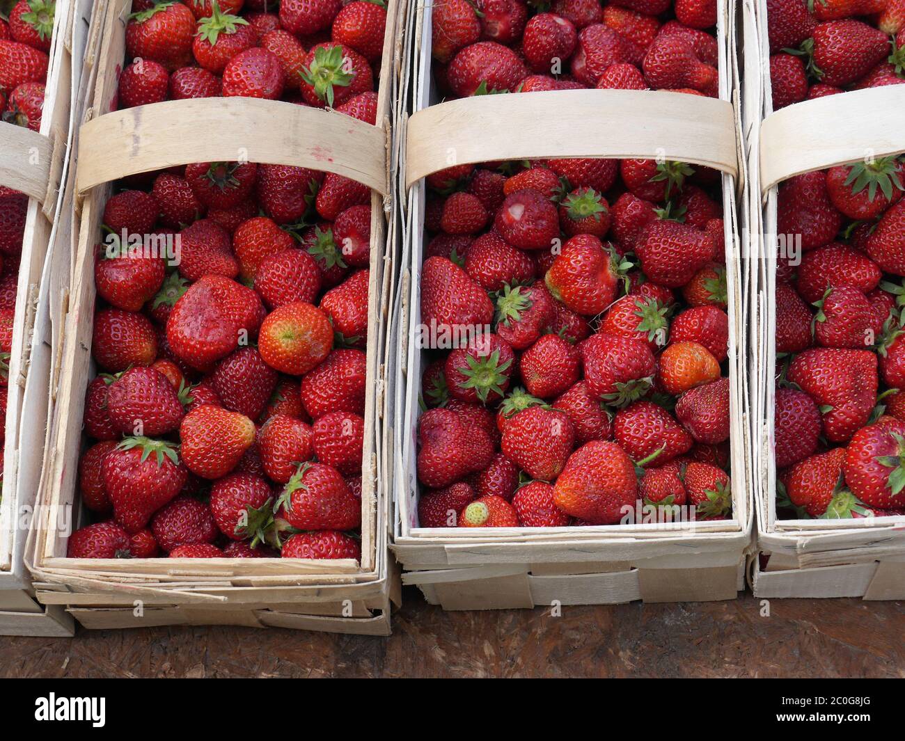 woodchip baskets with fresh strawberries Stock Photo