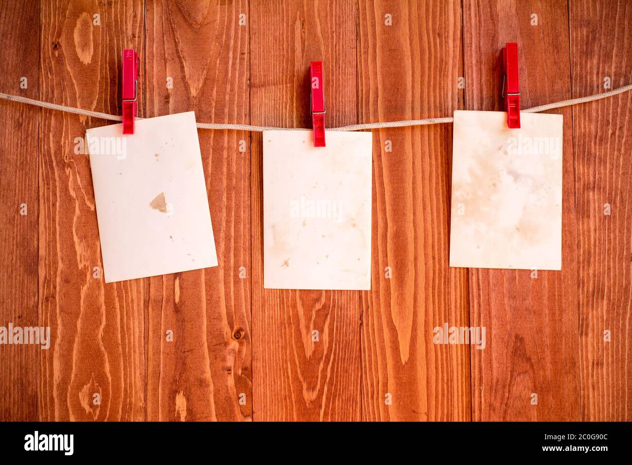 Photo frames hanging on a rope Stock Photo Alamy