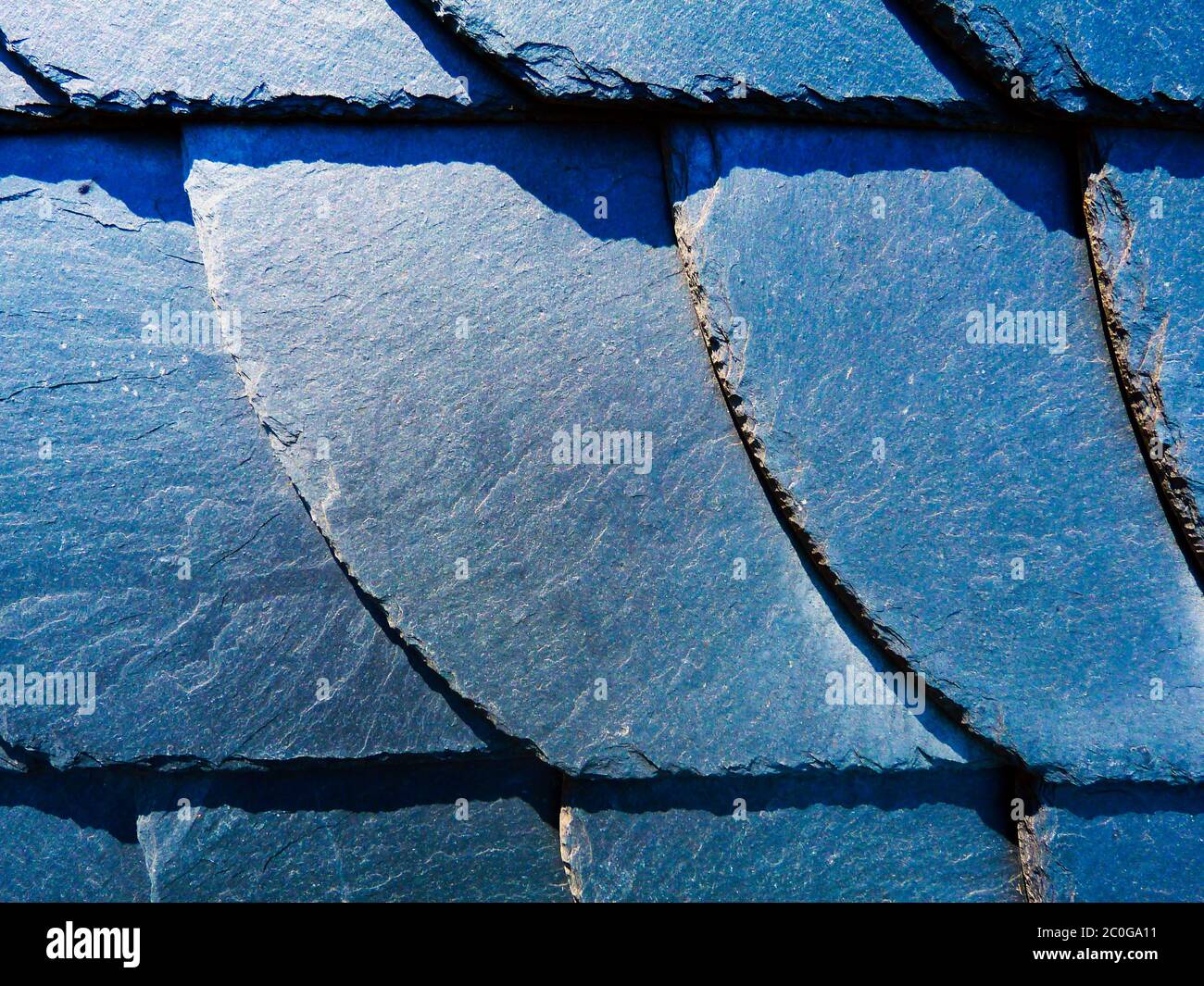 natural slate mineral tile covered roof detail. natural construction