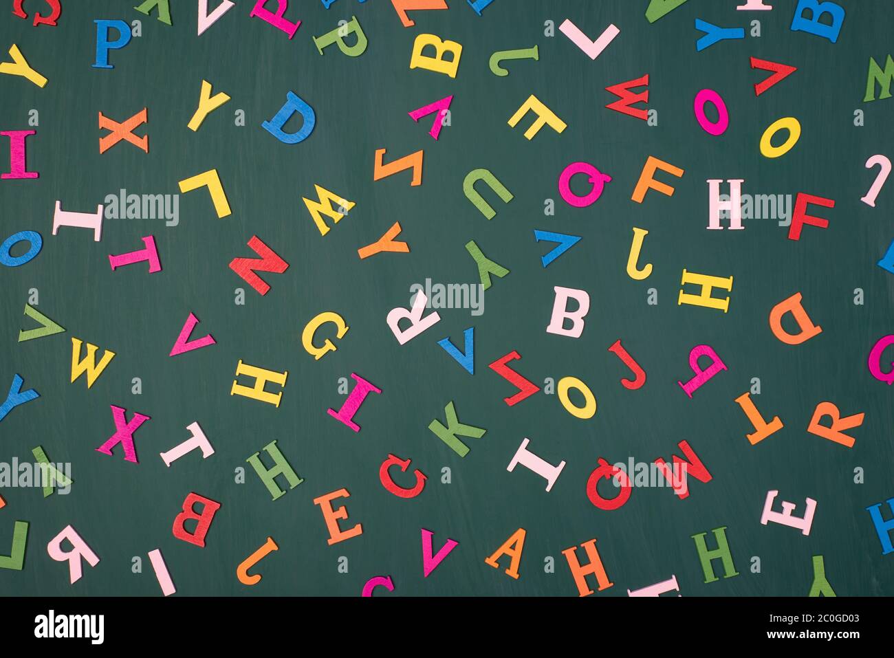 Letters background studying englidh language concept. Top above overhead view photo of colorful letters isolated on greenboard Stock Photo