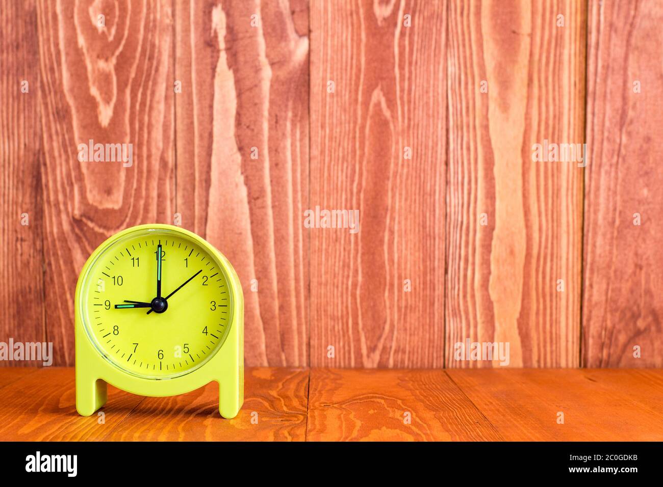 Alarm clock on the wood background Stock Photo - Alamy