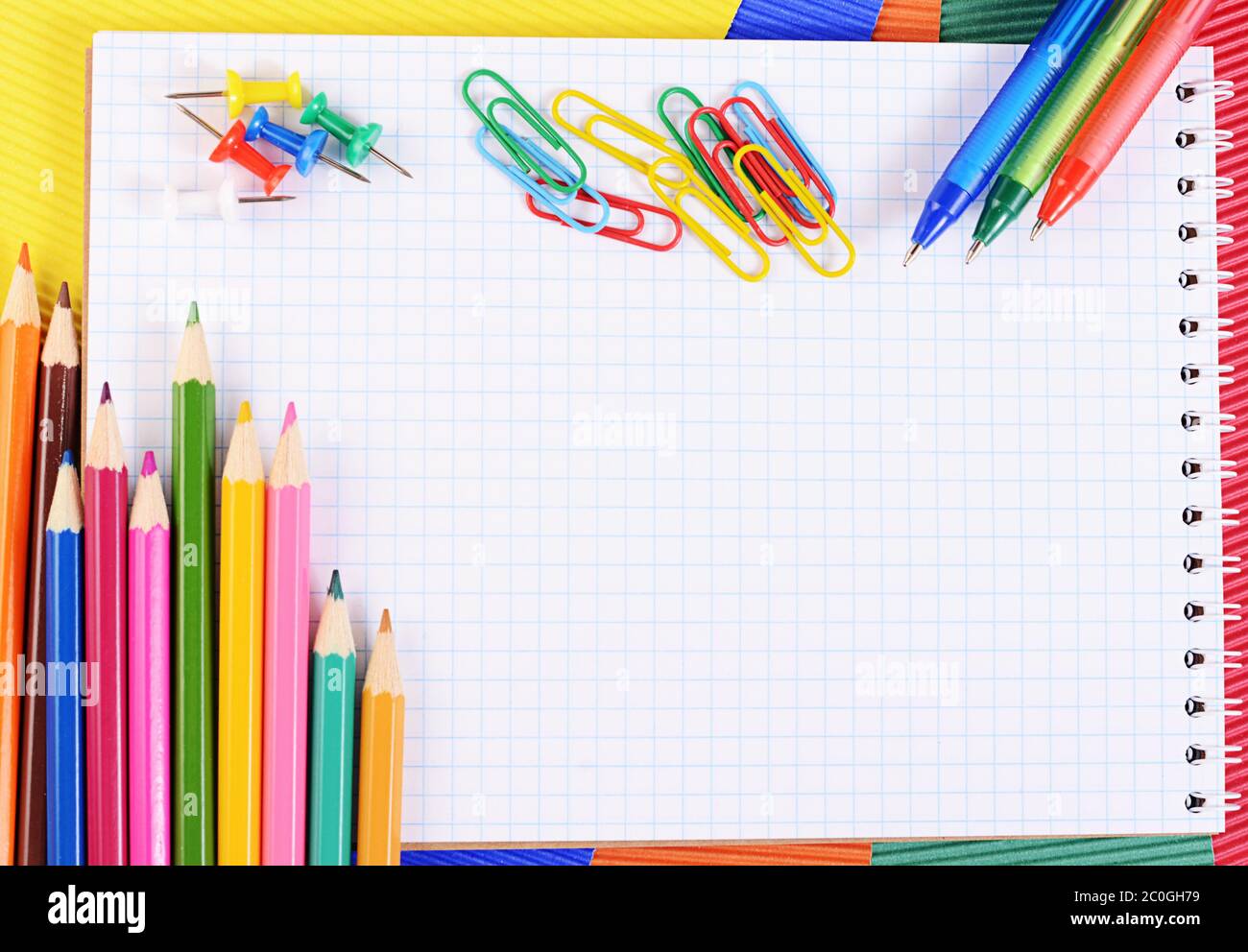 Color pencils on  paper with notebook Stock Photo