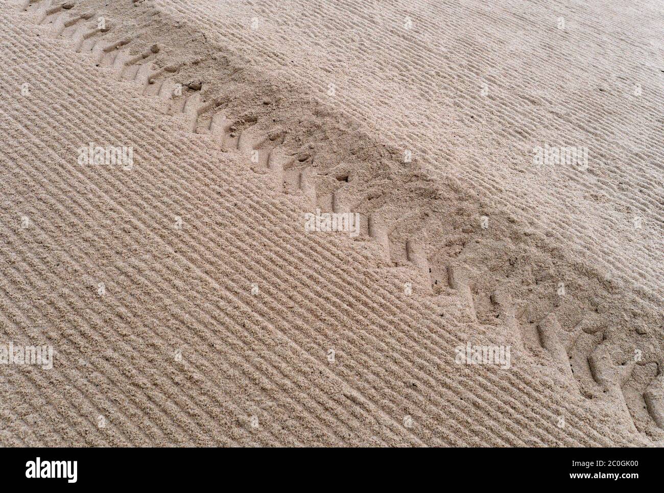 Tire tracks in the sand Stock Photo