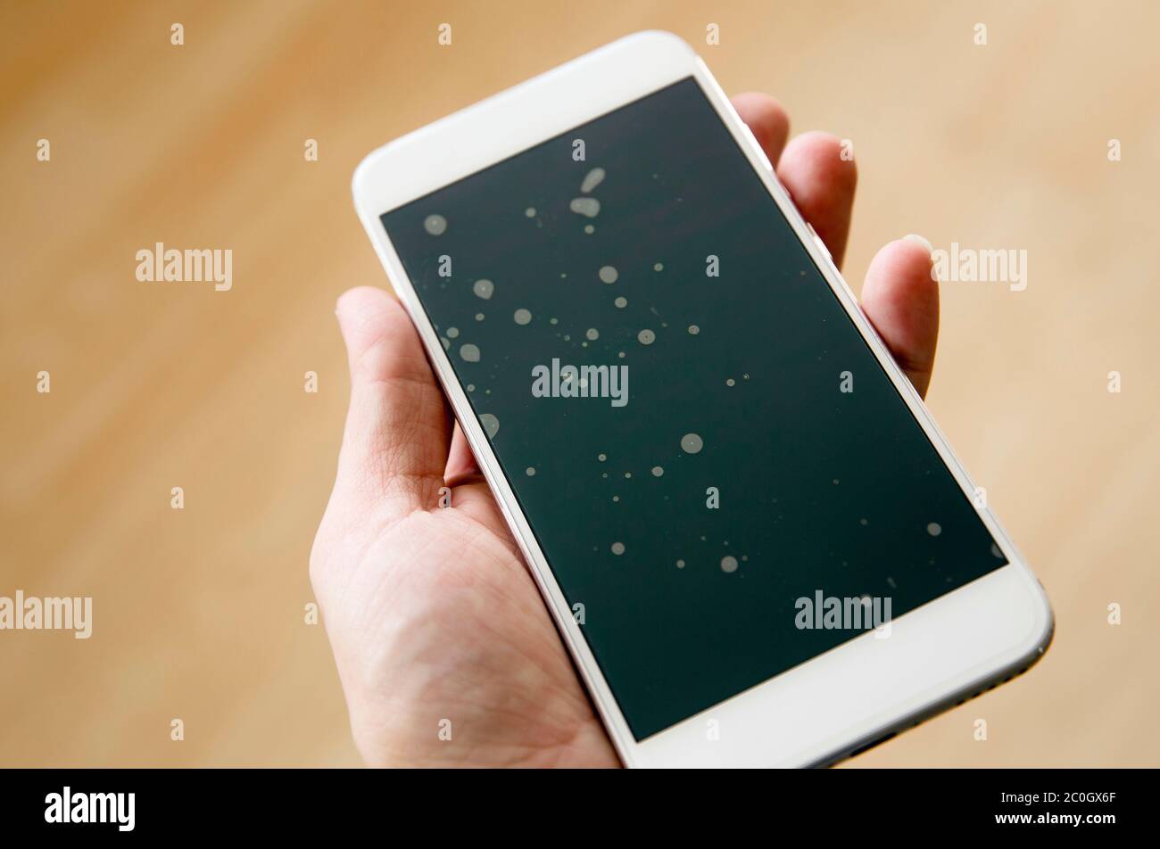 Badly installed smartphone protection screen glass layer with dust