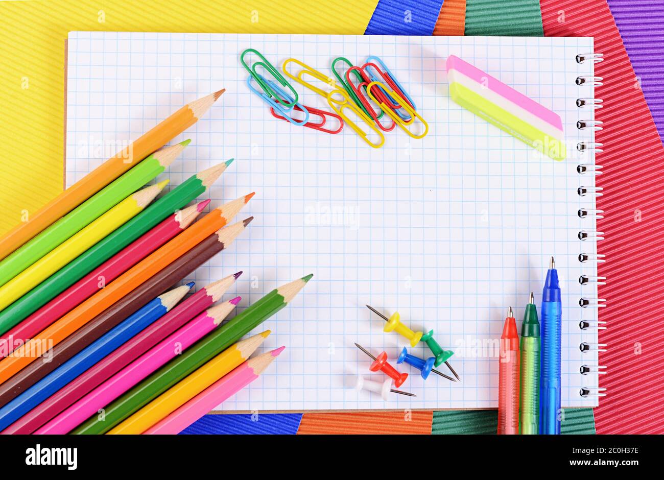 Color pencils on  paper with notebook Stock Photo