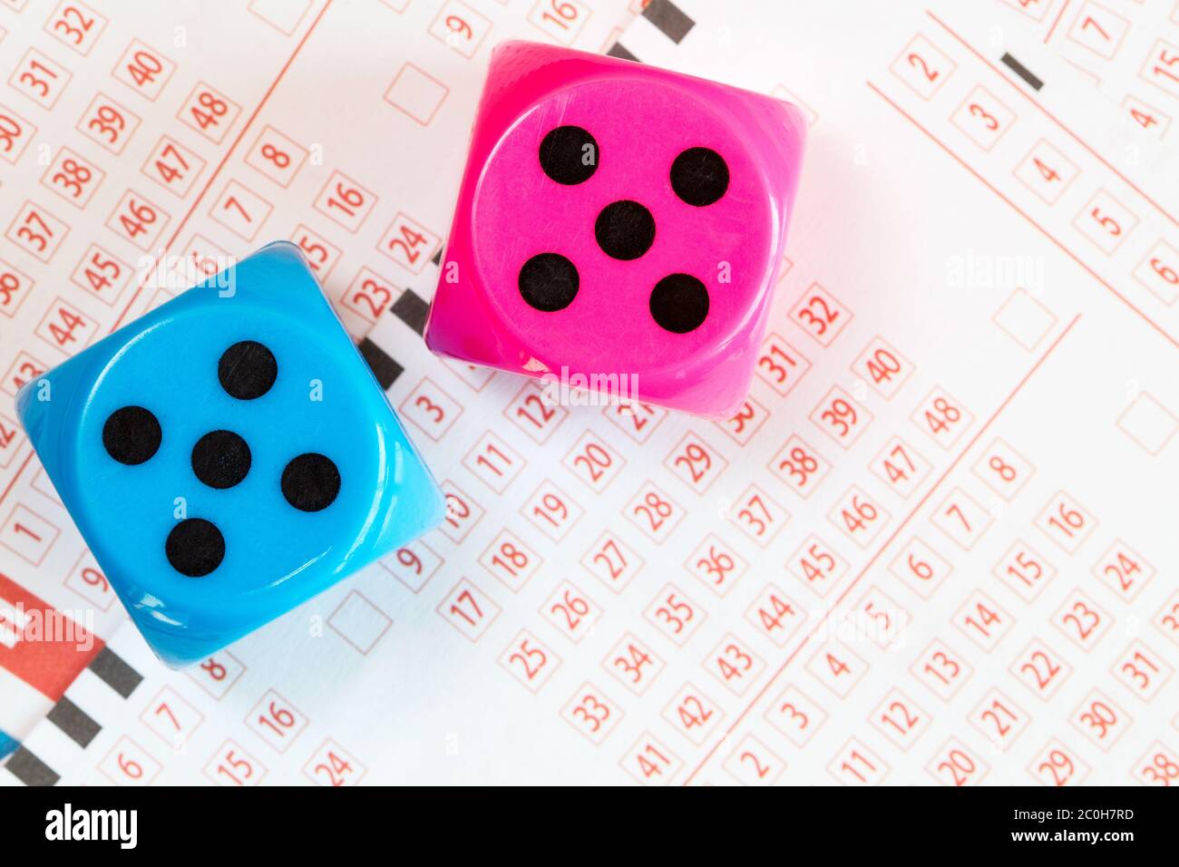 Lotto ticket and dice Stock Photo Alamy
