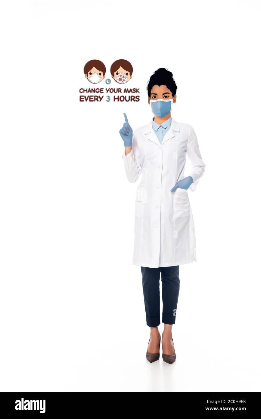 african american  doctor with illustrated face in medical mask pointing with finger at change your mask every 3 hours illustration on white Stock Photo