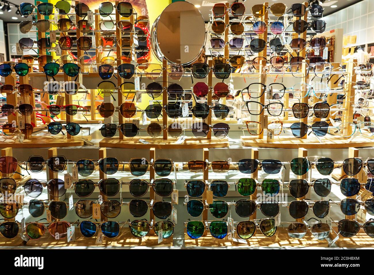 Showcase of sunglasses in a specialized store. Sunglasses store Stock