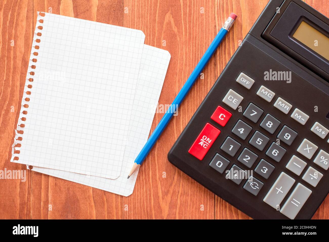 Paper sheets and calculator Stock Photo Alamy