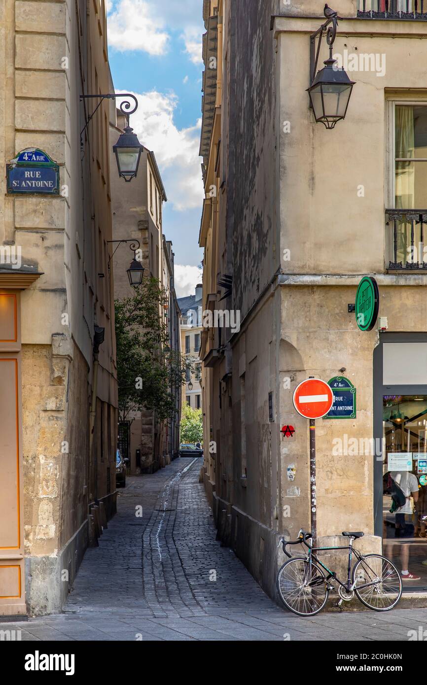 Paris, France - May 25, 2020: Small street with old street lamp near rue St Antoine in Paris Stock Photo