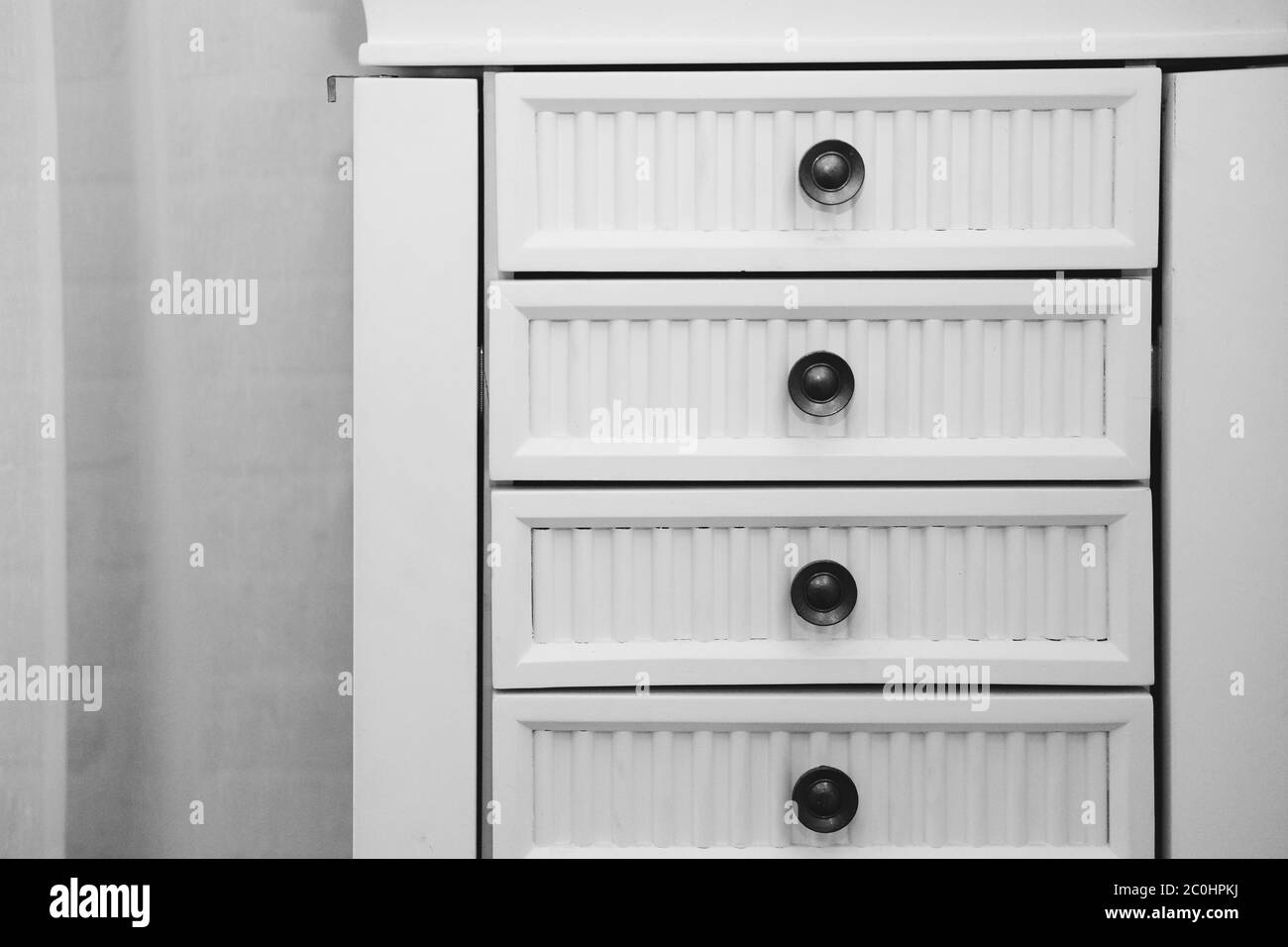 white wooden drawer cabinet in living room interior Stock Photo