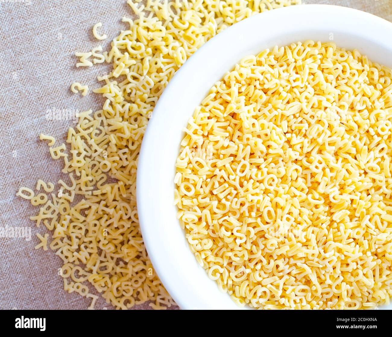 Pasta alphabet, raw italian pasta in bowl Stock Photo Alamy
