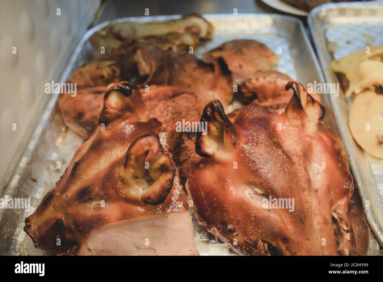 Smoked chopped pig heads sold on the streets of Hong Kong China Stock Photo