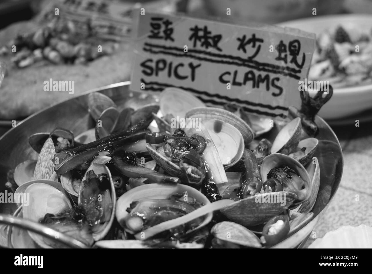 Full portion of spicy clams sold on a night market in Hong Kong China Stock Photo