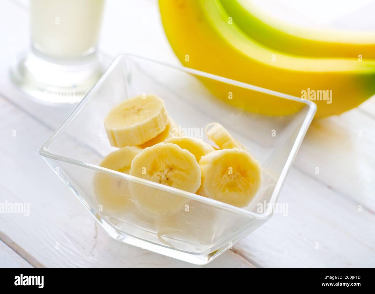 Fresh banana in the glass bowl, banana and milk Stock Photo - Alamy