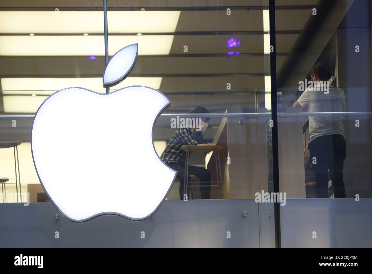 People inside the Apple store in the Victoria Square shopping centre, Belfast, after all shopping centres and retailers were given the green light to reopen in a significant relaxation of coronavirus lockdown restrictions in Northern Ireland. Stock Photo