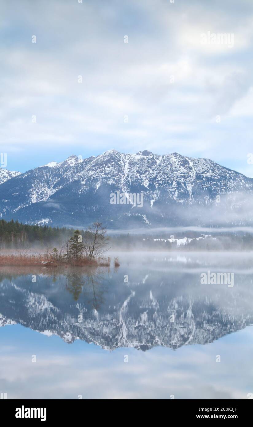 mountains reflected in alpine lake Stock Photo - Alamy