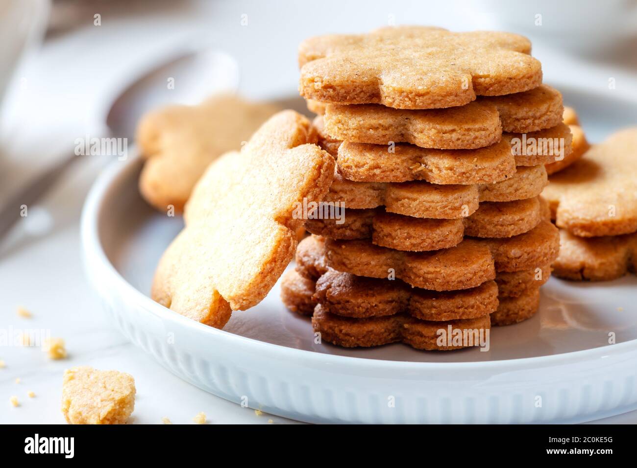 Freshly baked homemade cinnamon cookies stacked on a plate for breakfast as a Good Morning concept Stock Photo