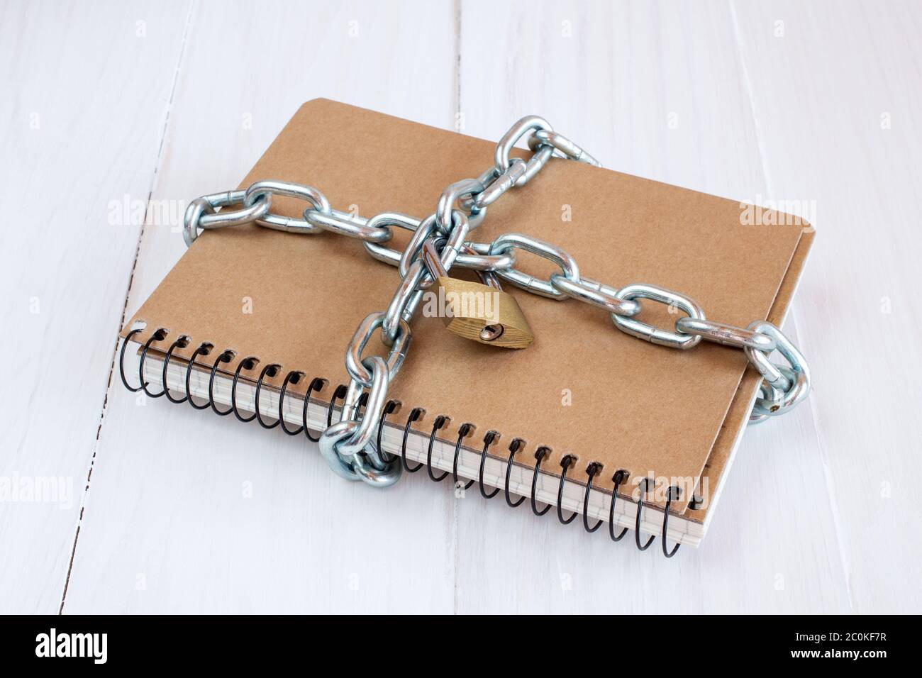 Padlock protects the notepad Stock Photo