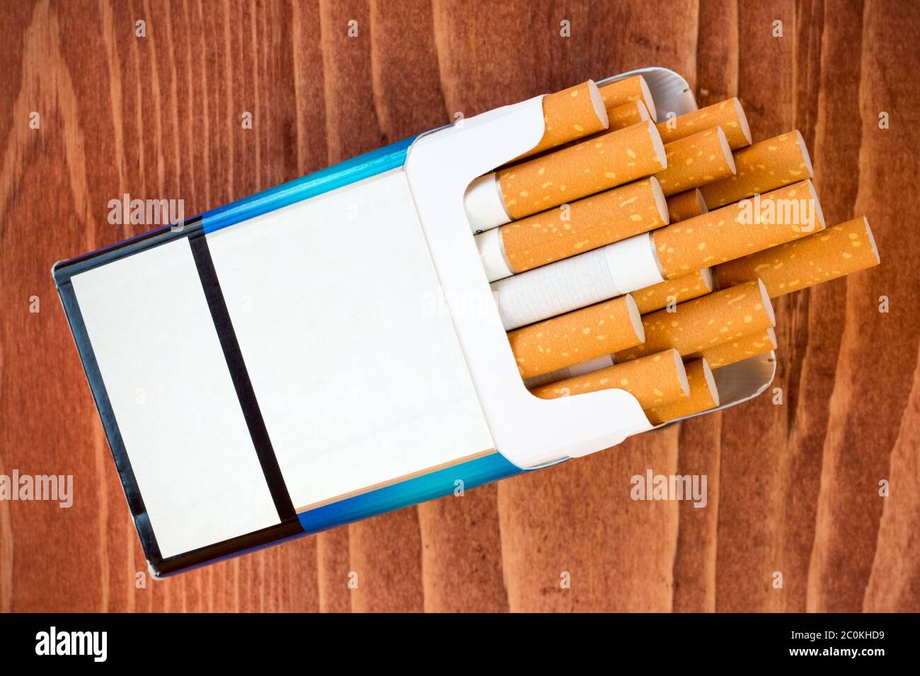 cigarette pack on table Pack of cigarettes on brown table Stock Photo