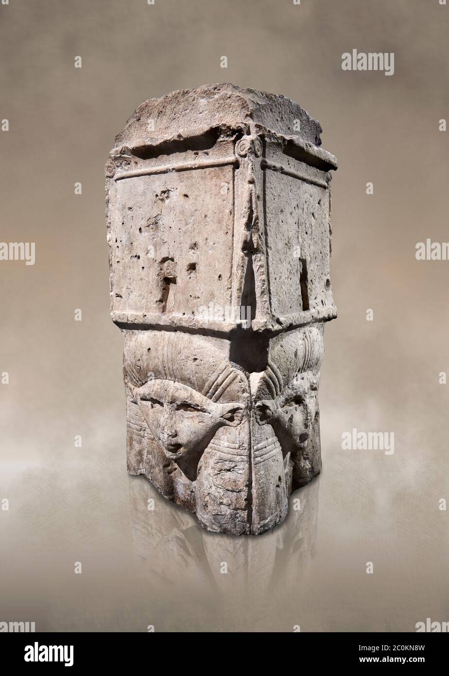 Ancient Egyptian four sided capital dedicated to Hathor, limestone, Ptolomaic Period (332039 BC). Egyptian Museum, Turin. Grey background. Cat 7031. Stock Photo