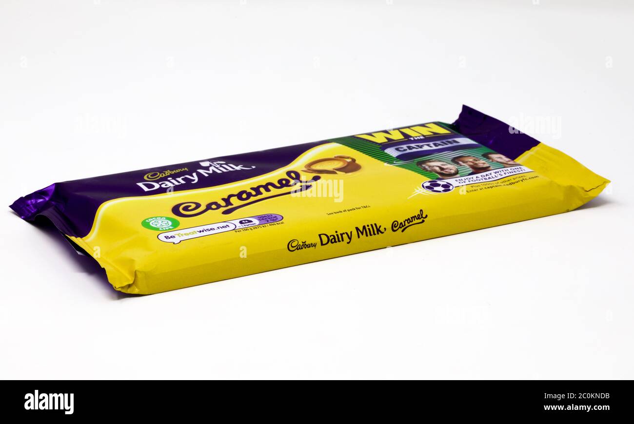 Cadbury’s Dairy Milk Caramel chocolate bar with Win the Captain promotional wrapper Stock Photo