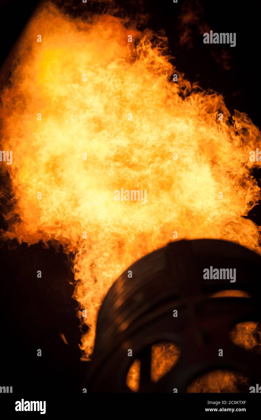 Flames in the night to heat up a hot air balloon. Stock Photo