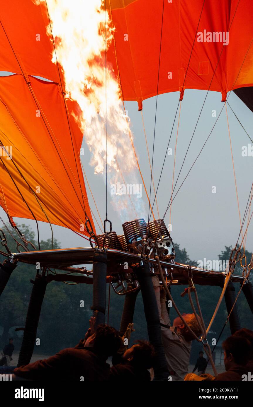 Hot air balloon crew starting fire Stock Photo