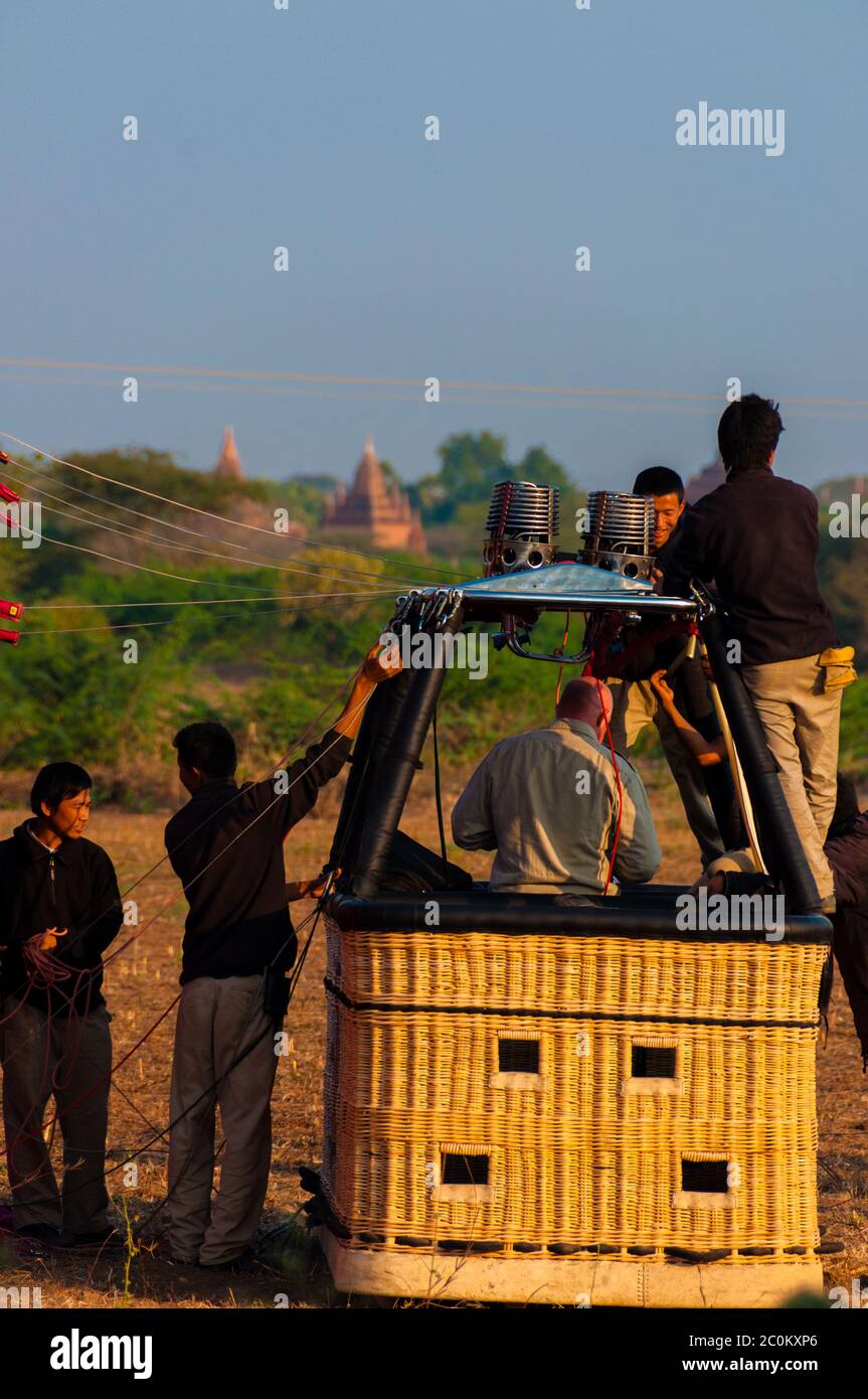 Hot air balloon crew working in basket Stock Photo