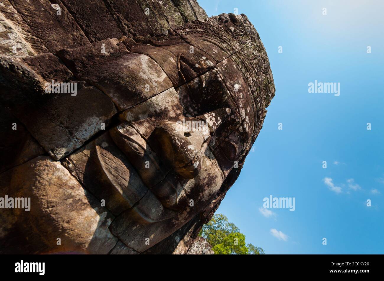 Head encarved in stone Bayon temple Angkor Wat Stock Photo