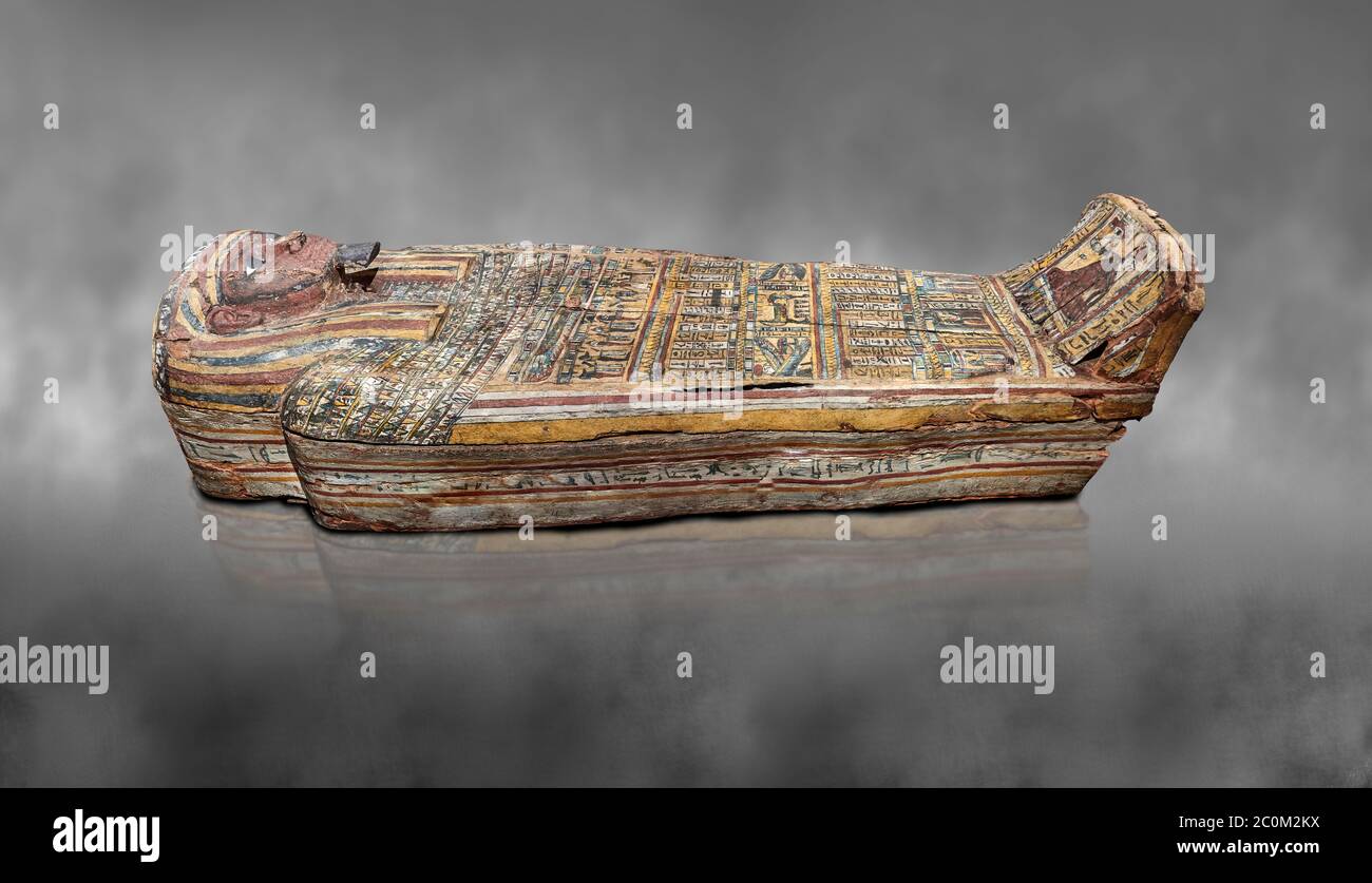 Ancient Egyptian wooden sarcophagus - the tomb of Tagiaset, Iuefdi, Harwa circa 7th cent BC - Thebes Necropolis. Egyptian Museum, Turin. Grey backgrou Stock Photo