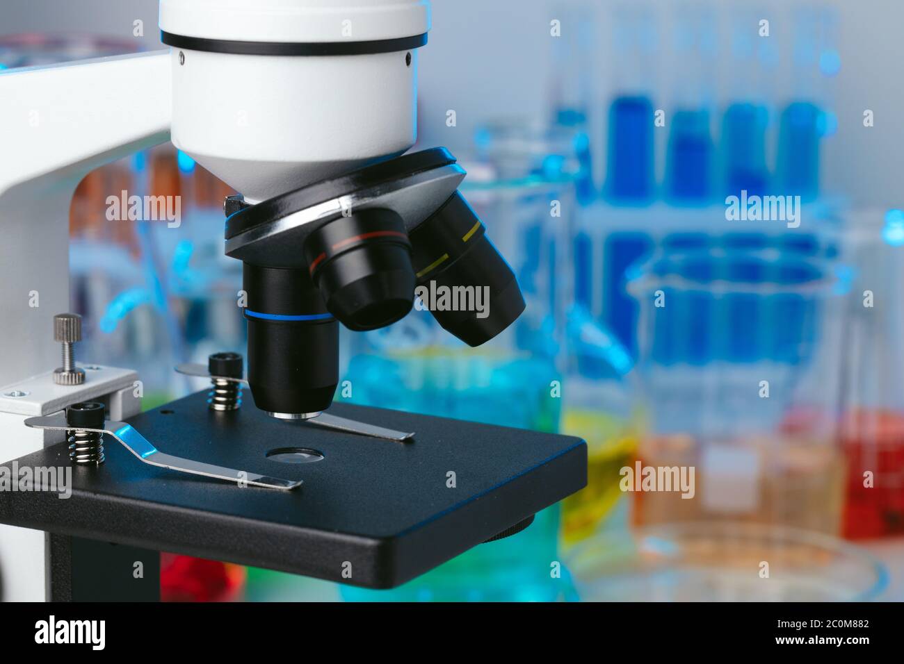 Scientific laboratory with microscope and test tubes with samples ...