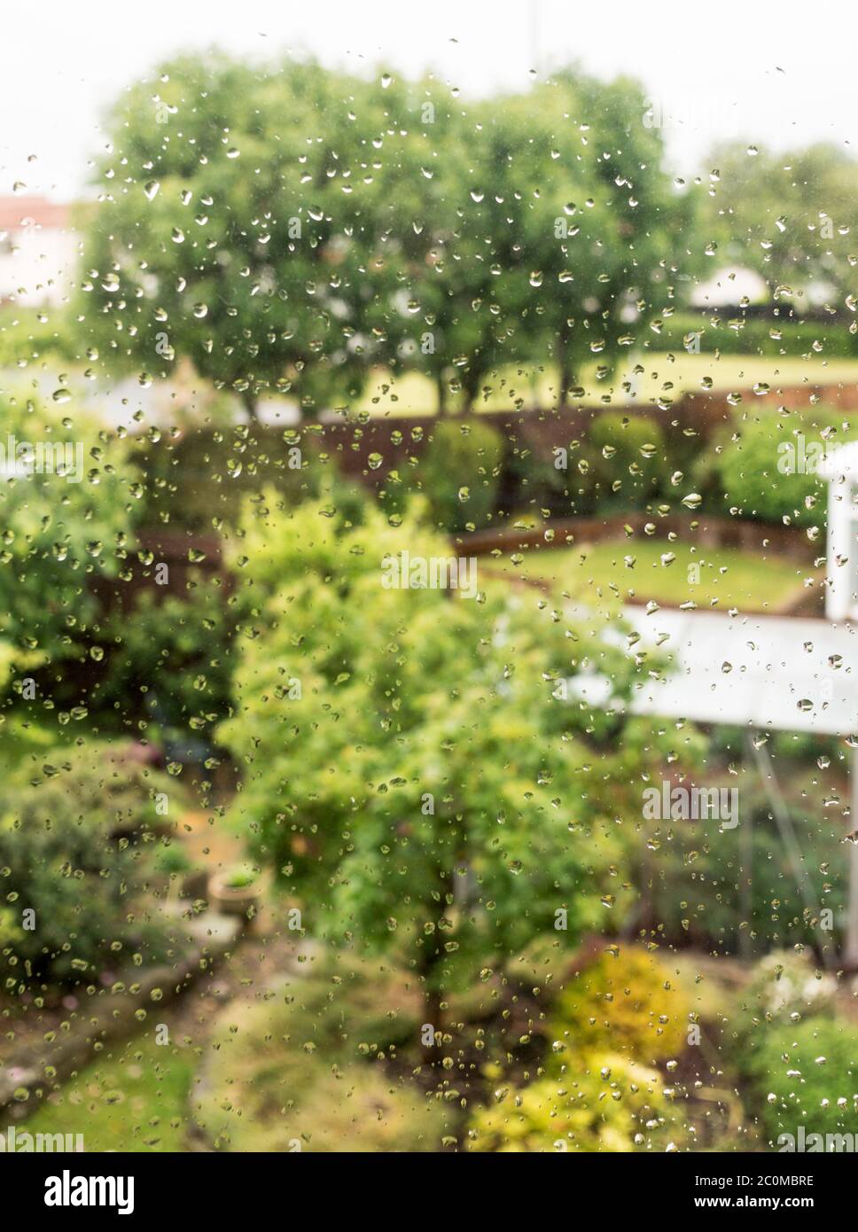 Raindrops on house window, England, UK Stock Photo
